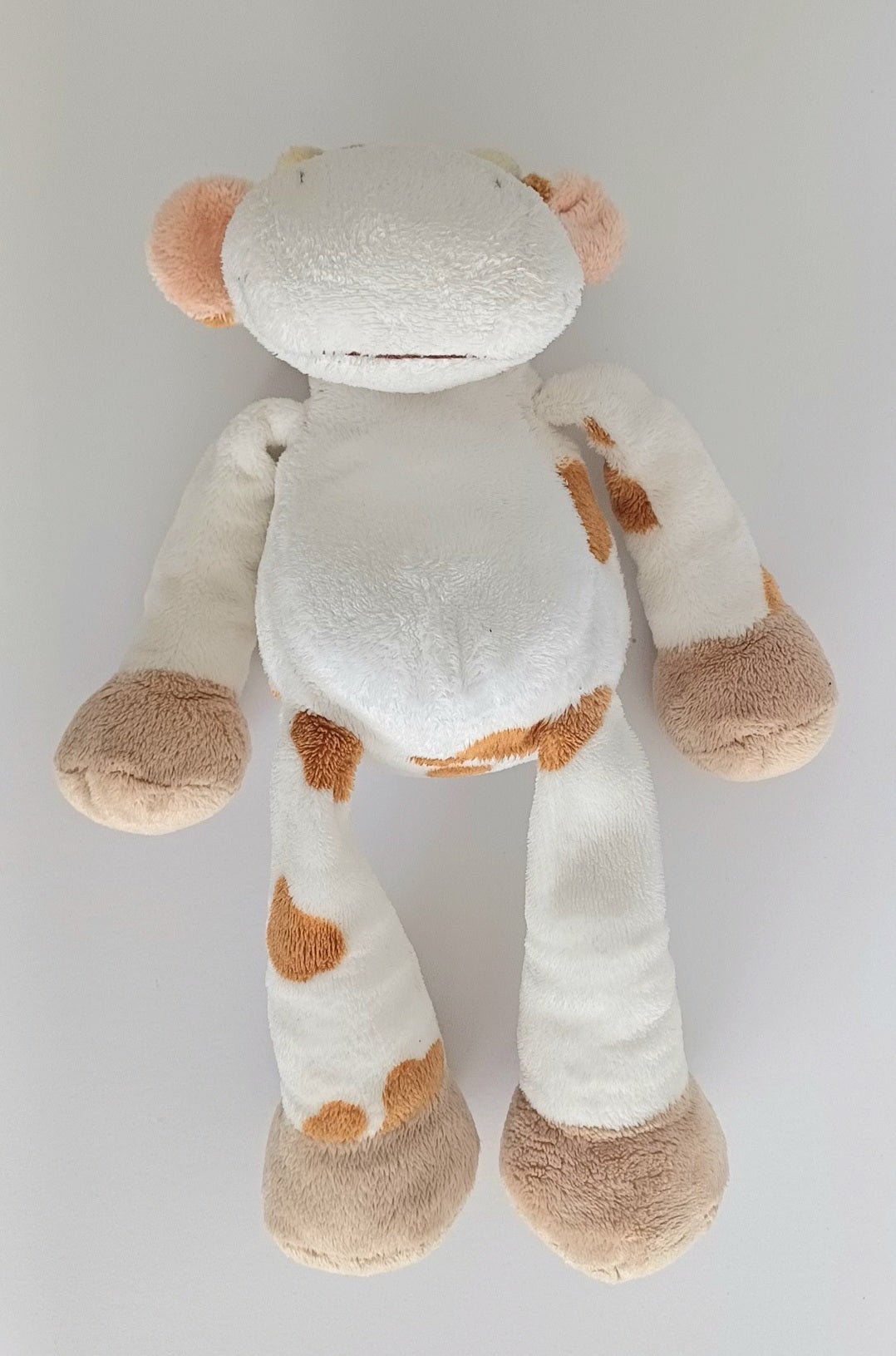 Doudou vache blanche et marron Nicotoy